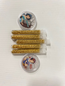 (2) Disney Collectible Coins “Jasmine and Snow White” and (5) Bottles of Gold Flake