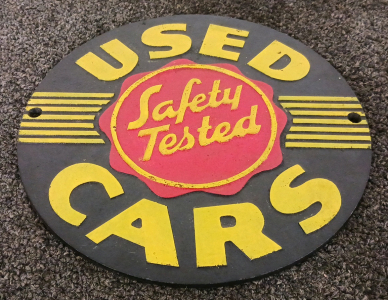 9" Diameter "Safety Tested Used Cars" Metal Sign