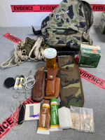 Survival Pack- Camo Backpack, Face Paint, Rope, Forsceps, (2) Pocket Knives, Saw, Partial Box of Shot Gun Shells, Obsidian Arrowheads, plus more