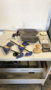 (2) Irwin Quick Grip clamps (2) wooden Bowls (1) seramic horse (7) small makeup wallets