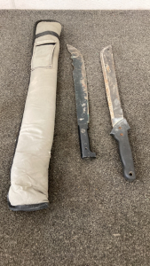 (2) Machetes In McDermott Fishing Pole Case