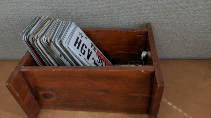 Box of Used License Plates