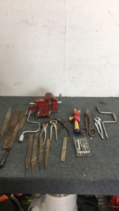 (1) Home Bench Vise (2) Hand Socket Drivers (2) Pairs Of Pliers (1) Pair Large scissor Snips (1) Horse shoe Tool (9) Various Files (1) Bin Of Drill Bits