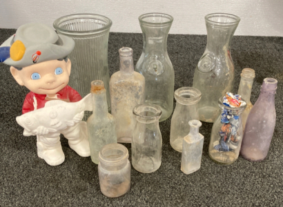 Assortment of Glass Bottles And Half Painted Fisherman