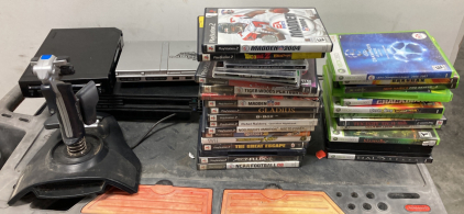 (2) PS2, (1) Wii, (1) Joystick, & (31) Assorted Games