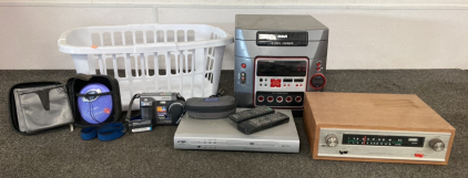 Assorted Electronics In Laundry Basket