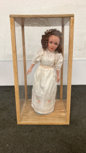 Porcelain Doll In Display Case