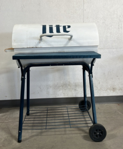 32" W x 25" D x 41" H Miller Lite Charcoal Grill