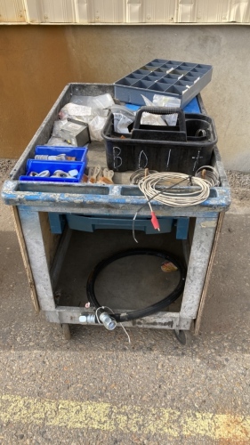 Plastic utility cart with assortment of hardware,nuts bolts, metal clamps etc.
