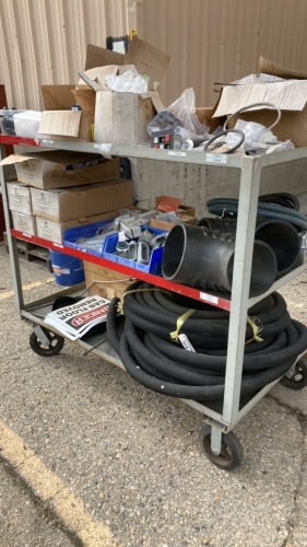 Metal cart with assortment of electrical parts and pieces