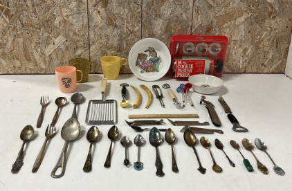 (19) Pieces of Decorative Silverware, (6) Vintage Can & Bottle Openers, 16pc Cookie Pastry Press, (3) Drinking Cups, (2) Bowls Decorated With Rabbits, and Assorted Other Kitchen Items