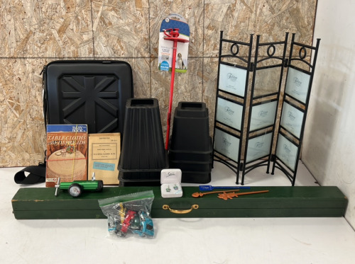 Photograph Display, (2) Sets of Furniture Risers, 38" W Projection Screen, 21" Heavy Duty Tie-Out Stake, (6) Toy Cars, Pair of Earrings, Laptop Case, (15) Assorted Knitting/Crocheting Magazines, (2) Rifle Field Manuals, (3) Bookmarks, and 02 Regulator