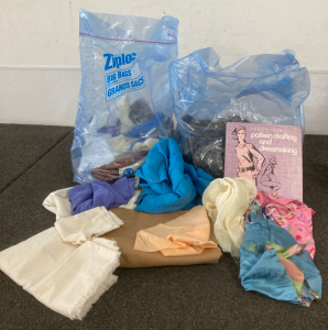 Assortment Of Fabrics And Dressmaking Book
