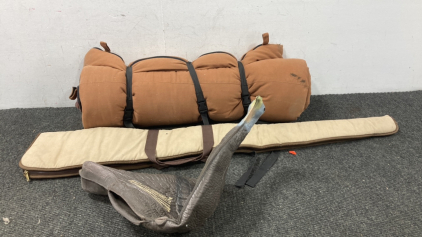 Sleeping Bag, Gun Case, And Fake Turkey