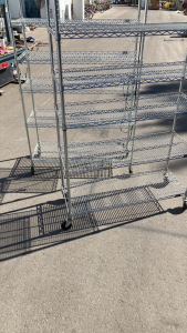 (2) 6 1/2’ tall racks with wheels