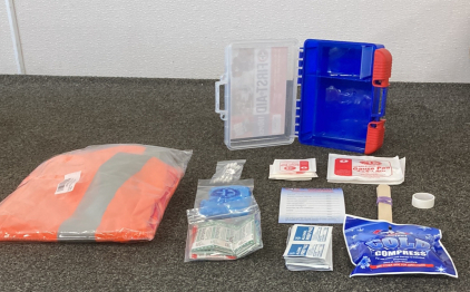 First Aid Kit And Orange Vest