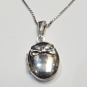 $140 Silver With St Silver Chain Locket