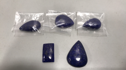(1) Rectangle Cabochon Afghan Lapis Lazuli 48.90 ct. (4) Pear Cabochan Afghani Lapis Lazuli. Various sizes.