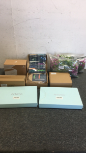 (2) Boxes Of (120) Air Fryer Disposable Liners (1) Htb Bamboo Butter Dish (1) Lifelaza Dryer Sheet Dispenser (2) Artena Blue Spoon Sets (2) Bouquets of Fake Flowers