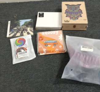 (2) Beatles CD albums, Ethnic Owl Puzzle, 6 Pack of Combs, Shower Curtain, Stickers