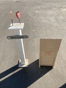 Dog feeder and wooden welcome sign