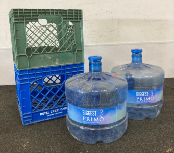 (2) Crates And Refilable Water Jugs