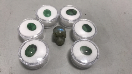 (6) Oval Cut and Faceted Brazilian Emeralds, (1) Labradorite Crystal Skull