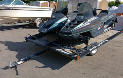 Trailer with (2) Arctic Cat Snowmobiles