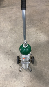 (1) Bally home oxygen tank (1) Oxygen Tank Roller Cart