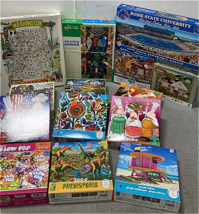 Puzzles Including a BSU 1000 Piece and Various other Puzzles