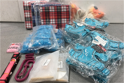 (6) Fleece Cage Liners, (2) Tiger Shaped Chew Toys, (6) Lg Harnesses, (3) Bags of Aquarium Stones, (2) Pack of Fur Remover Tools, (2) Collars, (1) “I Love My Mommy” Pet Shirt