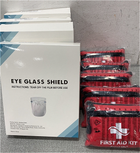 (4) Boxes Of Eye Glass Shields And (5) First Aid Kits