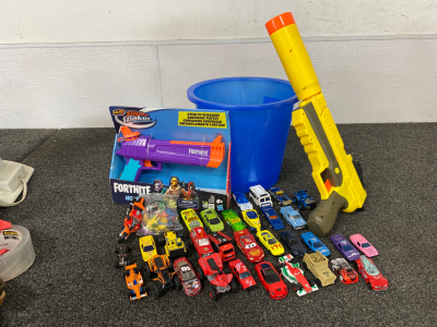 Assorted Metal/ Plastic Cars, Pokémon Figures, Fortnite Gun, Nerf Gun and Blue Bucket