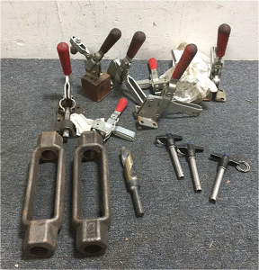 (8) De-Sta-Co Vertical Hold Down Toggle Clamps (3) Jergens Push Button Ball Lock Pins (2) 1-1/4” Steel Turnbuckles (1) High Speed Steel 15/16” Drill Bit