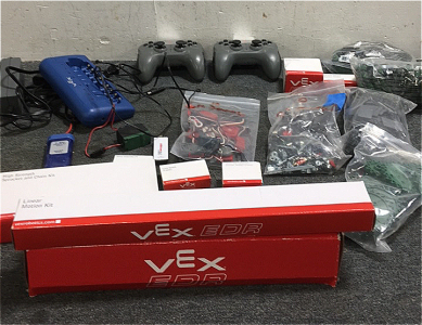 (2) Vex Edr Wireless Joysticks (2) Optical Shaft Encoder (1) bag Of Vex Robot Gears (1) Bag Of Vex Tank Tracks (6) Vex Omni Directional Wheels (1) High strength Sprocket and Chain Set (1) Vex Parts Booster Kit (1) Vex Linear Motion Kit (2) Vex Smart charg