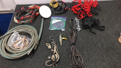 (1) Box of Miscellaneous Items - Truck Bed Net, Bungee Cords, Garden Hose, (2) Jumper Cables, and more