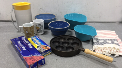 (2) Ceramic Mixing Bowls, (2) Measure and Pour Bowls, Cast Iron Pan w/ Rounds, (2) Coffee Mugs, Plastic Pitcher, Towel, (2) Reynolds’s Wrap Foil, Slow Cooker Liners