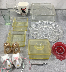 Glass 8x8 Bakeware w/ Lid, (3) Glass 4x4 Ramekins w/ (1) Lid, Glass Deviled Egg Service Dish, Copper Salt and Pepper Shakers, Swan Salt and Pepper Shakers, (1) Clear Coca-Cola Glass, (1) Small Green Coke Glass, “Meowy Christmas Mug”, Egg Tester, Toothpick