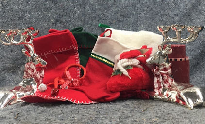 (5) Christmas Stockings, (2) Silver Reindeer Candle Holders, (1) Red Christmas Candle Holder