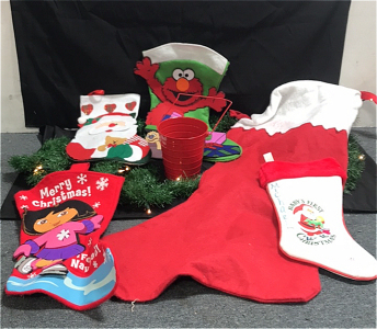 (1) Dora Feliz Navida Stocking, (1) Elmo Stocking, (1) Baby’s Firsy Christmas Stocking, (1) Santa Claus Stocking, (1) Giant Stocking, (1) Red Decoration Bucket, (1) Light Up Tinsel