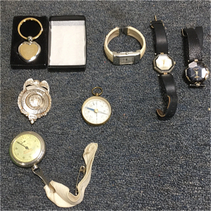 (1) Weiser Police Badge (1) New Haven Pedometer (1) Made In France Compass (1) Heart Shaped Keychain (1) Gucci Watch (1) Vienna Watch (1) La Cordera Watch