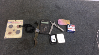 (1) Zippo Trout Lighter (1) HP 10b Business Calculator (25) American Gunner 9MM Bullets (5) Historical Replica Coins (1) Bertucci Watch (1) Sunto Core Watch (1) Leatherman “wave” multi tool