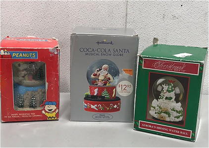 (1) Peanuts Snoopy Decorating Tree SnowGlobe, (1 Hallmark Coca-Cola Santa Musical Snow Globe, (1)House of Llyod Christmas Around The World Aurora’s Shining Water Ball