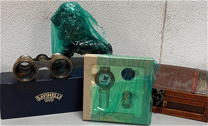 (1) Pair of Chevalier Paris Vintage Bionoculars, (1) Kapalua Gift Pack, (1) Stone Lion, and more