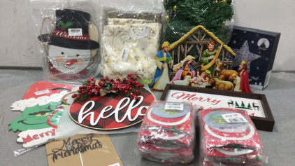 (2) Gold Tree Skirts, 9ft Gold Accent Garland, Lighted Star Tree Topper, Metal Nativity Sign, Welcome/Merry Christmas Wood Sign, (2) Pack of Snow Globe Greeting Card Kits, Wood &ldquo;Hello&rdquo; Sign, Grinch Sign, Snowman and Santa Welcome Signs, &ldquo;Merry Friendsmas&rdquo;