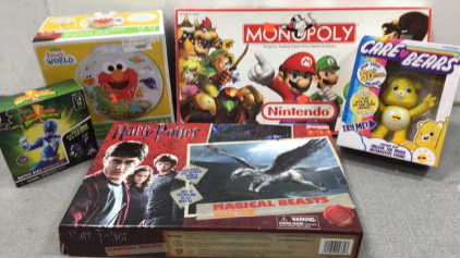 Nintendo Monopoly, Elmo’s World Fish Bowl Kit, Care Bear Figure, Power Rangers Battle Bike Construction Set, Harry Potter Magical Beasts Board Game