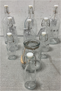 (9) Glass Bottles With Flip Tops And A ‘Mason’ Jar With Handle