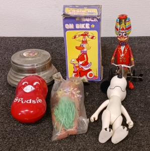 Vintage Toys Including Snoopy and Duck on a Bike