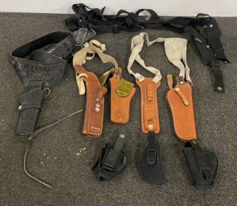 Various leather Long Revolver Holsters and smaller Nylon compact holsters.