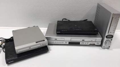 (4) DVD Players, (1) Samsung DVD/VHS Player